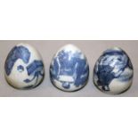 A GROUP OF THREE CHINESE BLUE & WHITE PORCELAIN BIRD FEEDERS, each with figural decoration, each 1.