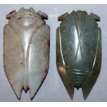 TWO SIMILAR CHINESE JADE CARVINGS OF CICADAS, one dark celadon green in tone, the other white with