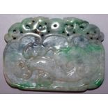 A CHINESE APPLE-GREEN JADE PENDANT, decorated to one side with a bat, the reverse side with lingzhi,