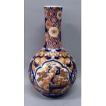 AN EARLY 20TH CENTURY JAPANESE FUKAGAWA IMARI PORCELAIN BOTTLE VASE, the sides painted with