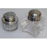 Two silver mounted glass inkwells.