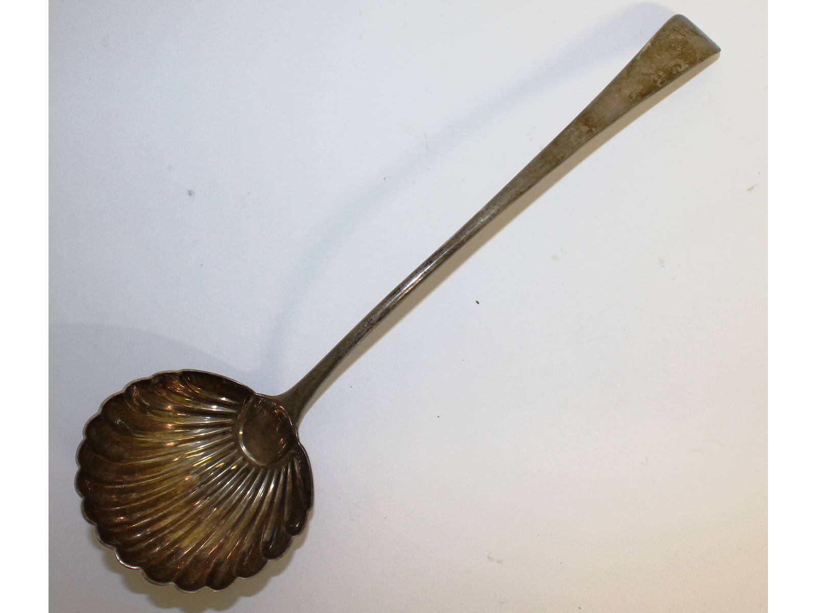 A George III soup ladle with shell bowl. London 1773.