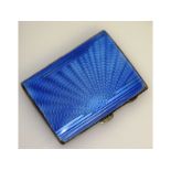 An Edwardian silver and blue enamel cigarette case.