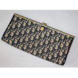 A Christian Dior initialled clutch bag.