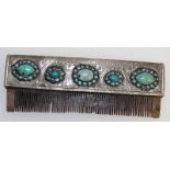 A Persian silver and turquoise comb, with horn teeth. 15cms long.