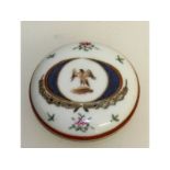 A small Chinese Armorial circular box and cover. 7cms diameter.