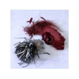 Hesti Hats, a comb hat with feathers and a Manhattan red handmade hat.