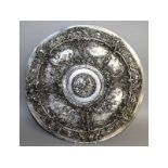 A good Elkington & Co circular plated dish, repousse with classical scenes. 19ins diameter.
