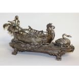 A good French plated centrepiece, a boat with cupid and swan, on a scrolled base. 21ins long.