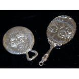 Two small silver hand mirrors.