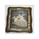 A miniature mother and child in a mother-of-pearl mounted frame.