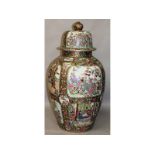 A large Chinese Canton enamel design vase and cover, with an all-over pattern of figures, flowers,