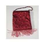 A Clio, Bond Street red beaded evening bag.