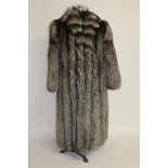 A good never worn full length fox fur coat.