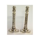 A good pair of Empire plate circular candlesticks. 11ins high.