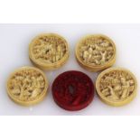 Five carved ivory Canton counters. 2.5cms diameter.