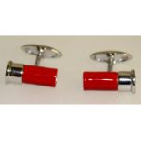 A pair of sterling silver and enamel cufflinks in the form of shotgun cartridges.