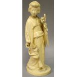 A GOOD JAPANESE MEIJI PERIOD IVORY OKIMONO OF A BIJIN, standing in engraved robes, holding a bunch