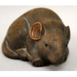 A FINE QUALITY JAPANESE MEIJI PERIOD CARVED WOOD MODEL OF A MOUSE, clasping its curled tail, its fur