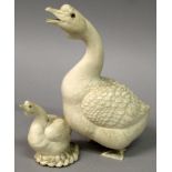 A FINE QUALITY JAPANESE MEIJI PERIOD IVORY CARVING OF A GOOSE & ITS YOUNG, their eyes inlaid and