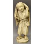 A LARGE FINE QUALITY SIGNED JAPANESE MEIJI PERIOD TOKYO SCHOOL IVORY OKIMONO OF A STANDING BOY,
