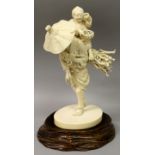 A FINE QUALITY SIGNED JAPANESE MEIJI PERIOD IVORY OKIMONO OF A WOODCUTTER, together with a carved