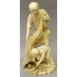 A FINE QUALITY SIGNED JAPANESE MEIJI PERIOD TOKYO SCHOOL IVORY OKIMONO OF A FISHERMAN & HIS SON, the