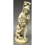 A SIGNED JAPANESE MEIJI PERIOD IVORY OKIMONO OF A FRUIT PICKER, in the company of her son who