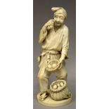 A SIGNED JAPANESE MEIJI PERIOD IVORY OKIMONO OF A FRUIT SELLER, holding a basket of fruit, a