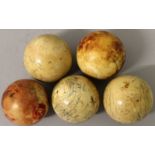 A GROUP OF FIVE EARLY 20TH CENTURY IVORY SNOOKER BALLS, approx. 2in diameter. (5)
