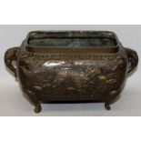 A JAPANESE MEIJI PERIOD BRONZE JARDINIERE, of rectangular form with rounded corners, the sides
