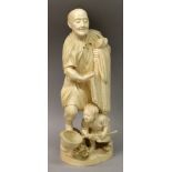 A LARGE FINE QUALITY SIGNED JAPANESE IVORY OKIMONO OF A FISHERMAN & HIS SON, the man standing on