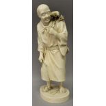 A LARGE GOOD QUALITY JAPANESE MEIJI PERIOD TOKYO SCHOOL IVORY OKIMONO OF A STANDING MAN, holding