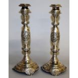 A PAIR OF REPOUSSE DECORATED CANDLESTICKS. London 1914.