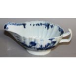 AN 18TH CENTURY WORCESTER FLUTED SAUCEBOAT painted each side with oriental fisherman on islands,