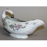 AN 18TH CENTURY EARLY WORCESTER COS LETTUCE SHAPED SAUCEBOAT moulded and painted with flowers.