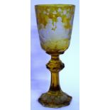 A VERY GOOD 19TH CENTURY BOHEMIAN AMBER GOBLET, the bowl engraved with classical figures drinking