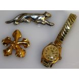 A SILVER .925 PANTHER BROOCH, flower head brooch and ladies wristwatch.