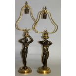 A SUPERB PAIR OF 19TH CENTURY FRENCH BRONZE AND ORMOLU LAMPS, naked classical ladies holding aloft