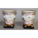 19TH CENTURY COALPORT VASES on four feet painted with flowers.