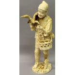 A LARGE JAPANESE MEIJI PERIOD SECTIONAL IVORY OKIMONO OF A FISHERMAN, feeding a cormorant, a