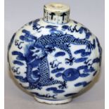 A 19TH CENTURY CHINESE BLUE & WHITE PORCELAIN DRAGON SNUFF BOTTLE, of larger than average size,