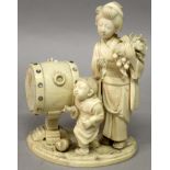 A GOOD QUALITY SIGNED JAPANESE MEIJI PERIOD IVORY OKIMONO, of a lady and her son standing beside a