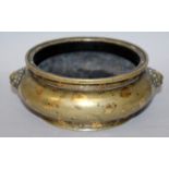 A GOOD 17TH/18TH CENTURY CHINESE GOLD SPLASH BRONZE CENSER, weighing 545gm, the sides cast with