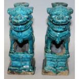 A PAIR OF CHINESE MING DYNASTY TURQUOISE GLAZED POTTERY JOSS STICK HOLDERS, each in the form of a