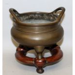 A CHINESE BRONZE TRIPOD CENSER, 19th Century or earlier, weighing 1.46Kg, together with a fitted