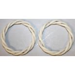 A PAIR OF CHINESE WHITE JADE-LIKE TRIPLE TWIST BANGLES, 3.1in diameter.