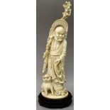 A GOOD QUALITY 19TH/20TH CENTURY CHINESE IVORY CARVING OF A SAGE, weighing 670gm, together with a