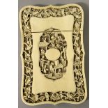 ANOTHER 19TH CENTURY CHINESE CANTON IVORY CARD CASE, of barbed rectangular form, each side carved in