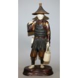 A GOOD SIGNED JAPANESE MEIJI/TAISHO PERIOD LACQUERED WOOD & IVORY SECTIONAL FIGURE OF A FISHERMAN,